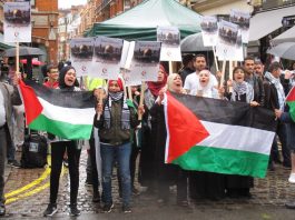 Defiant protesters shouting ‘Free Palestine’ as they display their national flags