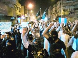 Night-time funeral of a Shia victim of the Saudi armed forces in the Qatif district