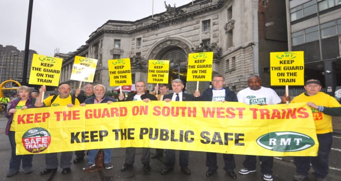 RMT demonstration yesterday morning at Waterloo Station demanding South West Trains keeps their guards on trains in the interest of passenger safety