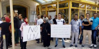 Palestinians demonstrate against the closure on August 11th of the UNRWA hospital in Qalqiliya