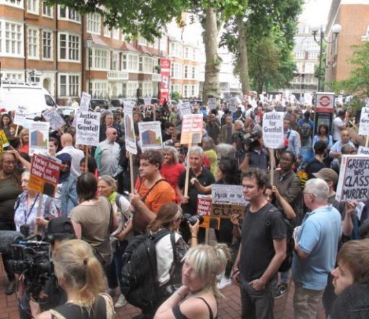 Grenfell survivors and their supporters demonstrate outside the Kensington & Chelsea Council Town Hall which ignored all  warnings of the dangers of an inferno at Grenfell Tower and then ignored them after it