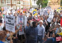 Grenfell survivors and local residents outside Kensington & Chelsea Council Town Hall demanding the resignation of the council