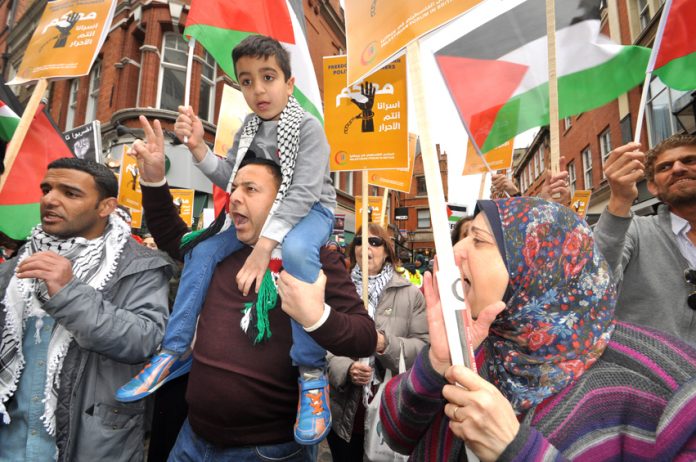 Palestinians outside the Israeli Embassy in London demanding the release of all political prisoners held in Israeli jails