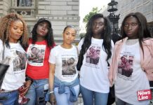 Cousins of Kadija Saye and her mother Mary Mendy, who both died in the Grenfell Tower inferno, on a march to Downing Street