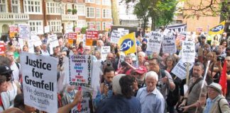 Grenfell Tower inferno survivors and local residents lobby a meeting of the Kensington and Chelsea council demanding it resigns
