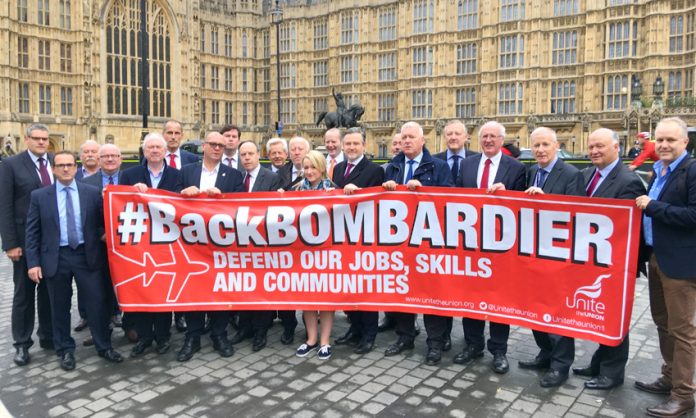 MPs and Bombardier workers outside the House of Commons where the workers demanded that the government defend their jobs