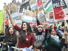 Palestinians demonstrate outside the Israeli embassy against the Israeli bombing of Gaza