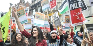 Palestinians demonstrate outside the Israeli embassy against the Israeli bombing of Gaza