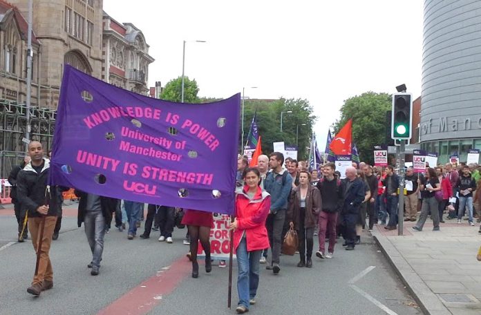 Lecturers, staff and students marching out of the University of Manchester – they are out on strike Monday and Tuesday