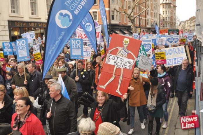 Midwives marching on the 100,000-strong demonstration in London to defend the NHS