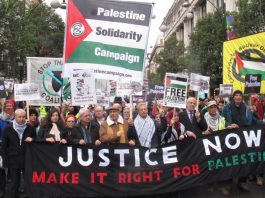 The front banner on the march in Oxford Street