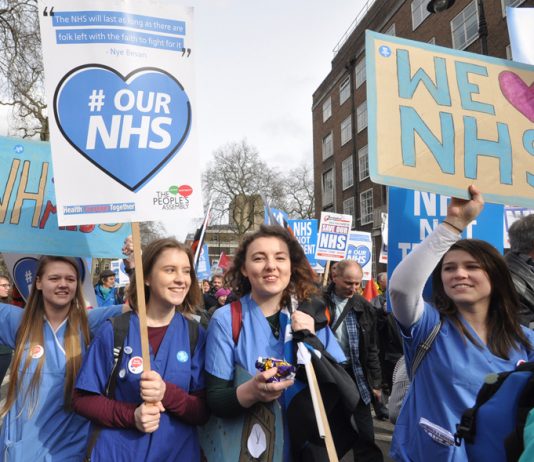 Student nurses marching in defence of the NHS