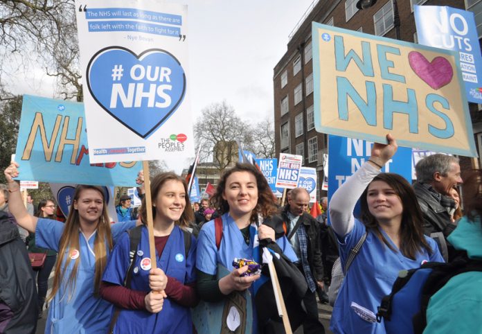 Student nurses marching in defence of the NHS