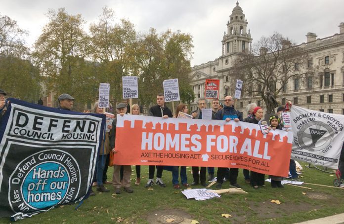 Defend Council Housing campaign insisting in Parliament Square during the Budget that council housing must be built to provide homes for everybody