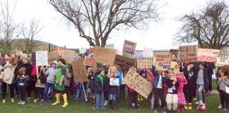 Teachers, parents and schoolchildren earlier in the year protesting at cuts to Brent schools – teachers at The Village School in Kingsbury, Brent, are taking strike action against forced academisation