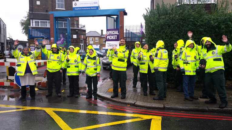 Deptford ambulance workers on the picket line during their nationwide strike in 2014 – they are overworked, understaffed and underpaid