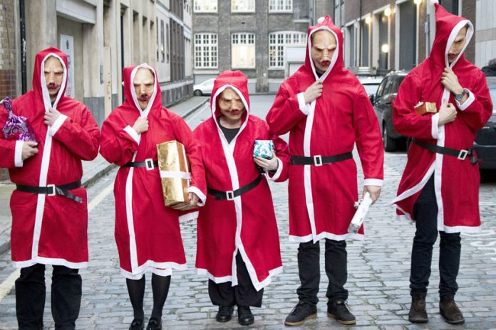 ‘Christmas Pigs’ demonstrated outside four hospitals yesterday lunchtime against private company ISS’ ‘workhouse’ conditions