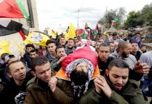 The funeral of Musaab al-Tamimi in the village of Deir Nitham, northwest of the city of Ramallah, to his last resting place. Photo credit: Tamer Bana/WAFA