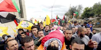 The funeral of Musaab al-Tamimi in the village of Deir Nitham, northwest of the city of Ramallah, to his last resting place. Photo credit: Tamer Bana/WAFA