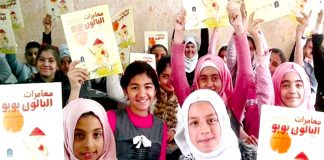 Young Iraqi girls hold copies of ‘The Adventures of Booboo the Balloon’. They are now writing their own stories