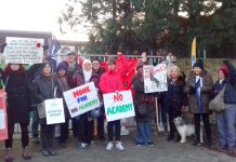 Teachers were joined by parents outside The Village School in Kingsbury, north west London, on their picket line yesterday morning