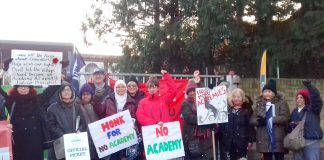 Teachers were joined by parents outside The Village School in Kingsbury, north west London, on their picket line yesterday morning