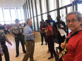 Tennessee workers fighting against the outsourcing of jobs and services to private companies occupy the state building in Nashville