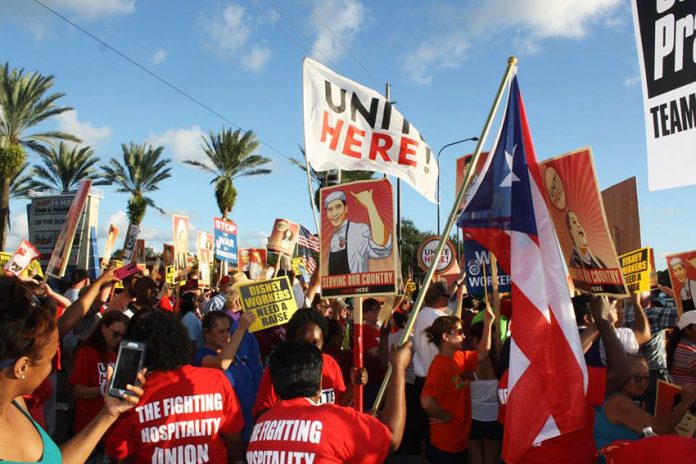 Unite Here Disney workers demonstrate in central Florida on Monday against the company withholding their $1,000 bonuses
