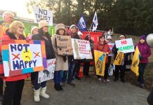 Striking NEU members on the picket line at The Village School in Kingsbury yesterday morning