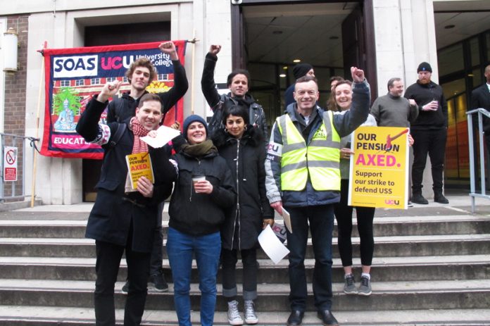Picket at the School of Oriental and African Studies (above right) in central London show their determination to defend their pensions