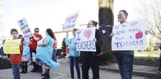 Raleigh County teachers and supporters picket at Shoemaker Square in Beckley during the first day of the statewide teachers’ walk-out