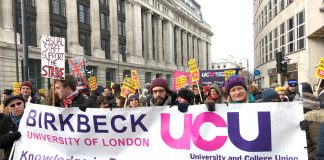 Thousands of lecturers marched through central London yesterday, the fifth day of their strike in defence of pensions