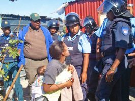 A South African woman is forcibly evicted from her home after the Marikana massacre