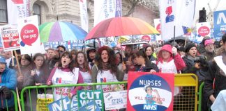 Nurses rally outside Downing Street demanding an end to cuts and for kicking privateers out of the NHS