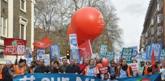 Health workers marching to defend the NHS, demanding no cuts, no closures and no privatisation