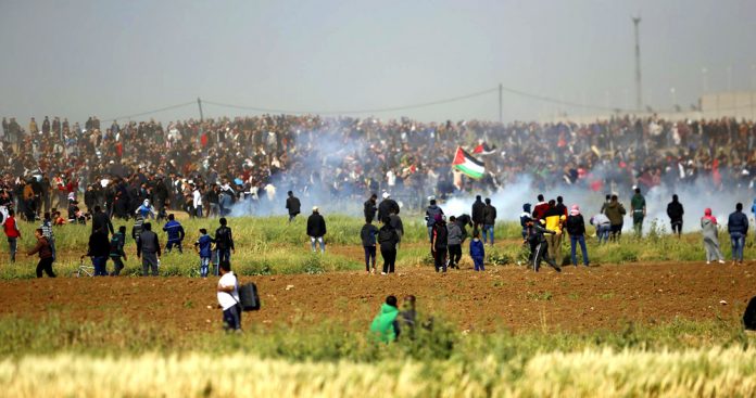 The thousands of Palestinians commemorating Land Day on Friday were shot at by Israeli snipers and bombed with gas from Israeli drones as they held a peaceful March of Return