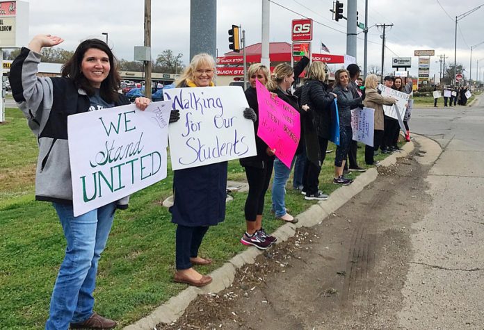 Teachers from school districts in Sequoyah County, Oklahoma on the picket line striking over pay and conditions