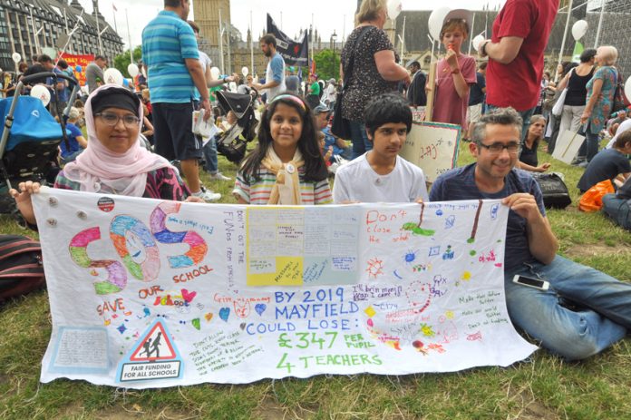 Parents and pupils protest against cuts in funding and loss of teachers