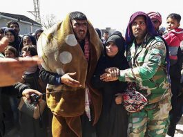Syrians leave Eastern Ghouta after it was liberated by the Syrian army