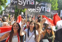 Hands off Syria’ demonstration in London in 2013 when former PM Cameron’s vote for bombing was defeated in Parliament – PM May has bypassed Parliament to authorise military action