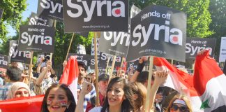 Hands off Syria’ demonstration in London in 2013 when former PM Cameron’s vote for bombing was defeated in Parliament – PM May has bypassed Parliament to authorise military action