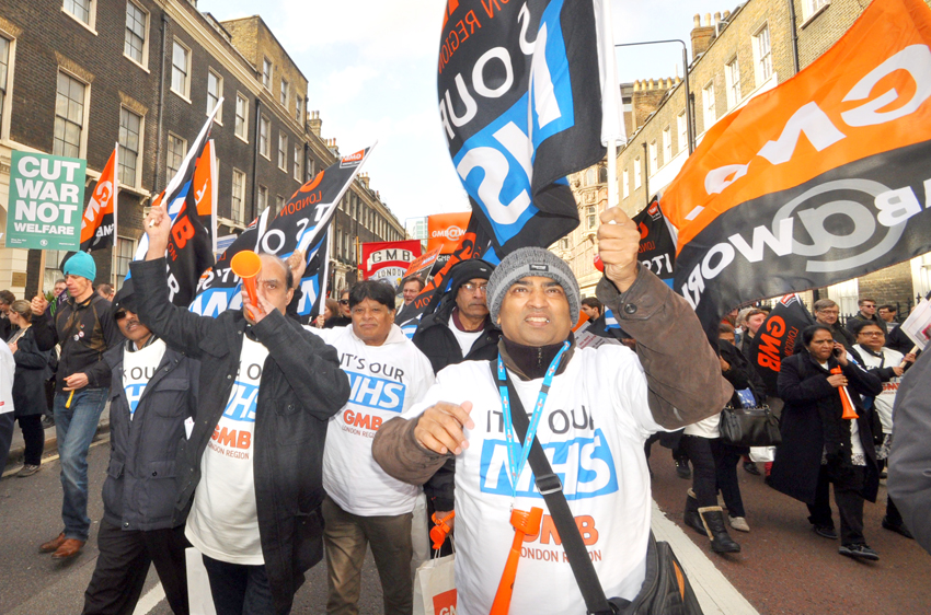 GMB members marching in defence of the NHS – the union is recommending a rejection of the pay offer