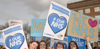 Nurses on the ‘Our NHS’ demonstration in central London – in Manchester health and council workers are striking against the merger of their services