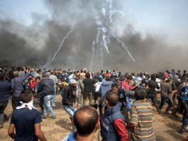 Palestinians on the Great March of Return on the Gaza border on Friday defy Israeli army snipers and hails of teargas