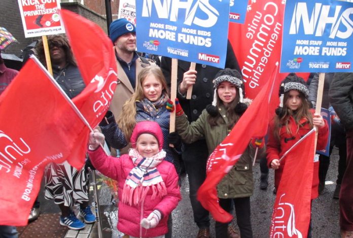 Children join the NHS march through London earlier this year – West Midlands Ambulance Service is pulling out of its contract