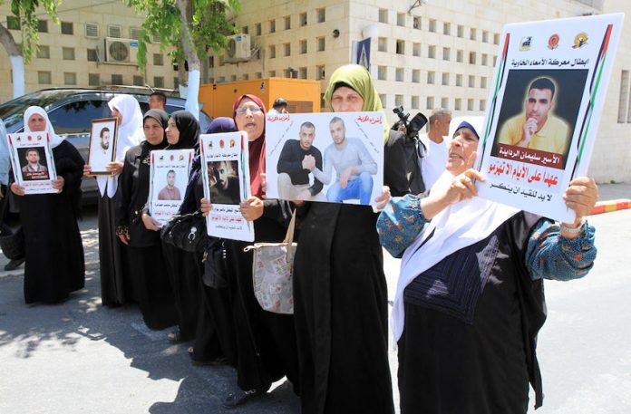 Palestinian prisoners’ families demonstrate in solidarity with the hunger strikers in the prisons of the occupation