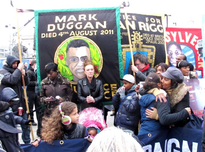 Banners of Mark Duggan, shot dead by police in August 2011 in Tottenham, sparking the summer uprising of youth