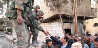 Syrian troops greet President Assad in Ghouta after successfully liberating the district from terrorist occupation