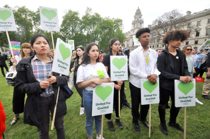 Protesters outside parliament in London, England yesterday on behalf of Grenfell tenants who died in the inferno