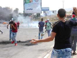 Palestinian youth clash with occupation forces at the Hawara checkpoint, south of Nablus city